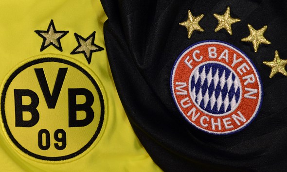 Jerseys of German football clubs Bayern Munich (R) and Borussia Dortmund are pictured on May 2, 2013 in Paris. Bayern and Borussia will face in an all-German UEFA Champions League 2013 final on May 25, the first time two Bundesliga clubs will meet for the European Cup. AFP PHOTO / FRANCK FIFE (Photo credit should read FRANCK FIFE/AFP/Getty Images)